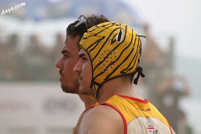 A Rugby union player wearing a tiger-print scrum cap, a form of headgear used fo.jpg