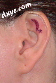 An attached earlobe, with a tattoo..png