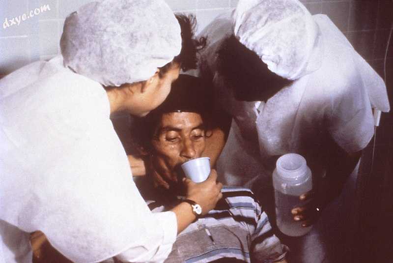 A person consuming oral rehydration solution.jpg